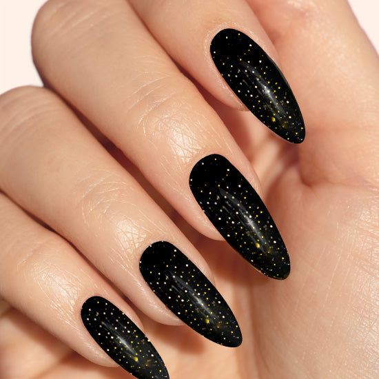 Black almond gel nails with gold glitter nail art